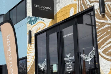 Building exterior with Transcend sign and artistic wall design
